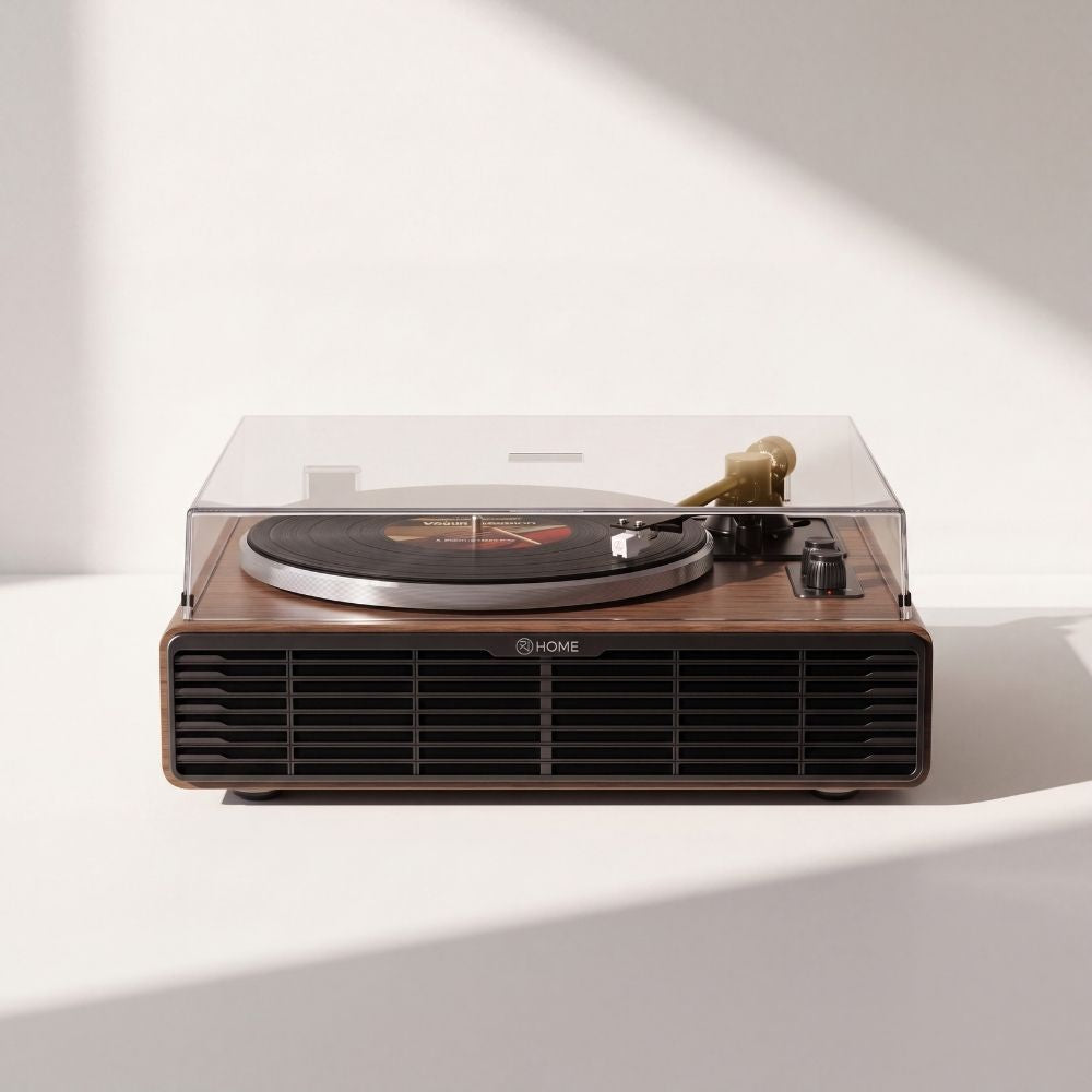 Platine vinyle Volute Noyer vue de face, capot fermé, coffret en noyer et grille de haut-parleurs